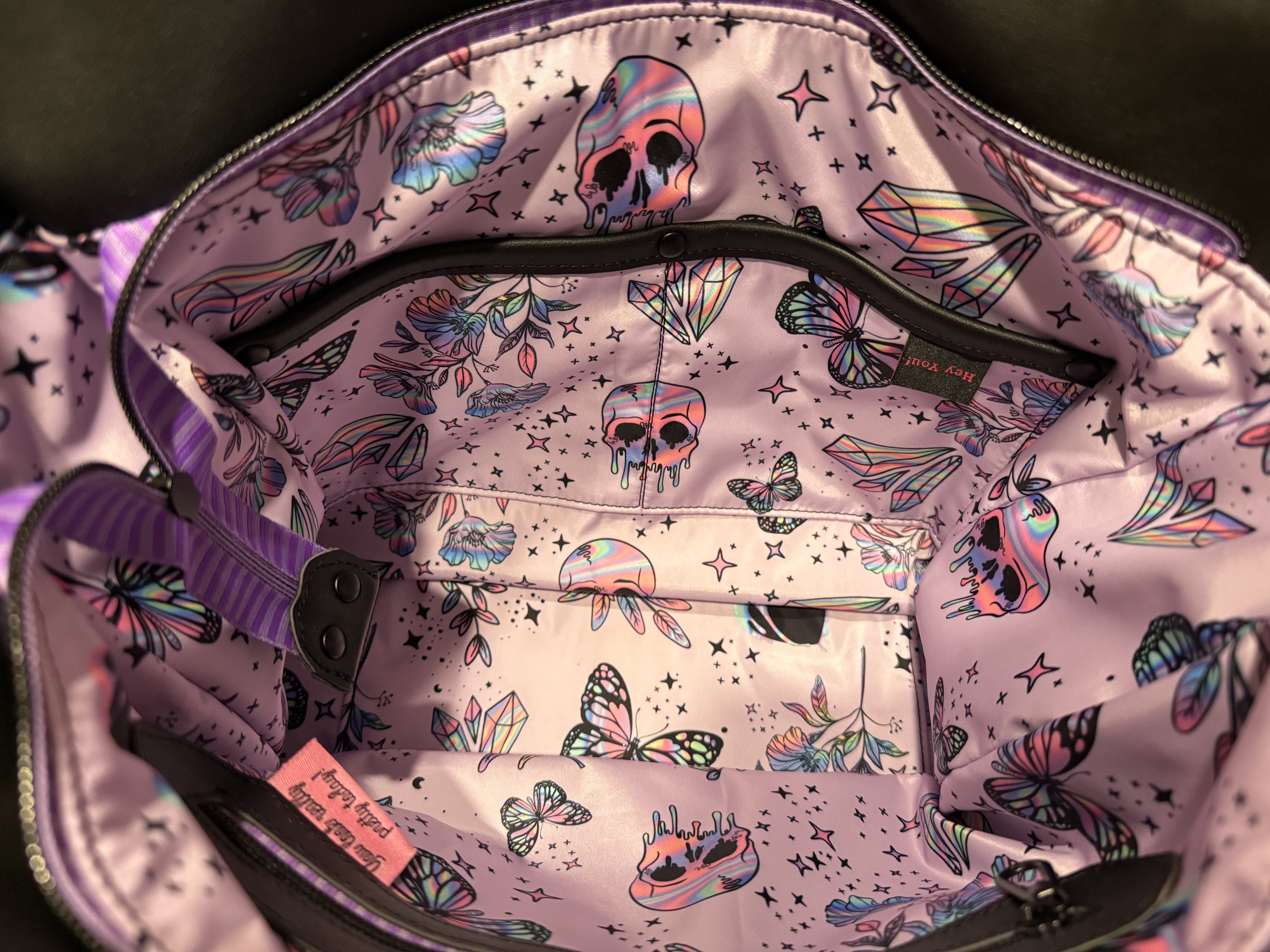 Side profile of hand-stitched floral purse
